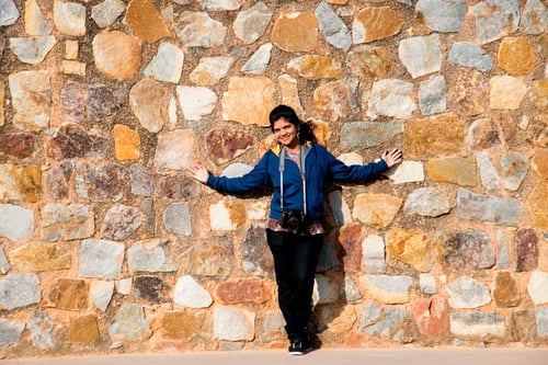 Preview: Portrait of Indian woman in front old stone wall.