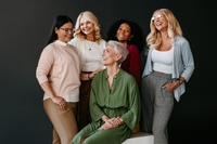Preview: Group of Smiling Women in Studio Setting