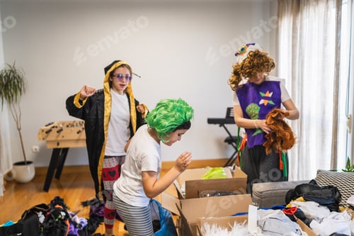Preview: Family playing dress up trying on carnival costumes