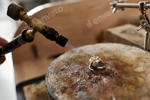 Preview: A skilled artisan crafting a magnificent jewel in a workshop filled with creativity and passion
