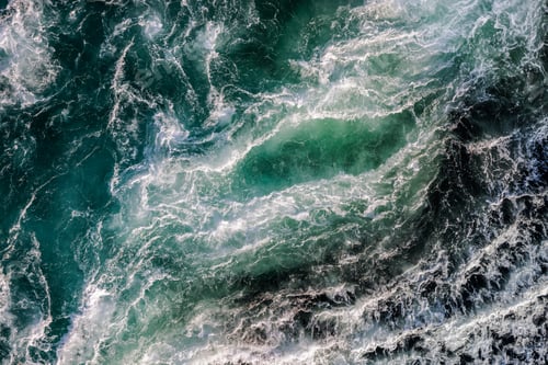 Preview: Blue waves of water of the river and the sea meet each other during high tide and low tide.