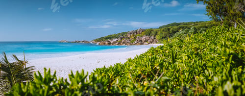 Preview: Most beautiful beach Grand Anse on La Digue Island, Seychelles with granite rock formations, white