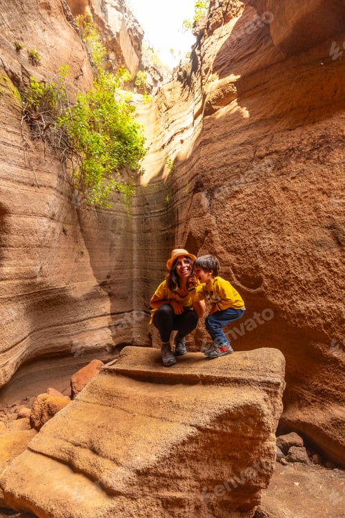 Preview: Family on vacation in the limestone canyon Barranco de las Vacas on Gran Canaria, Canary Islands