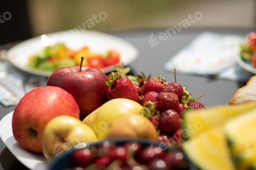 Preview: Closeup of tasty red cherries standing on plate on table