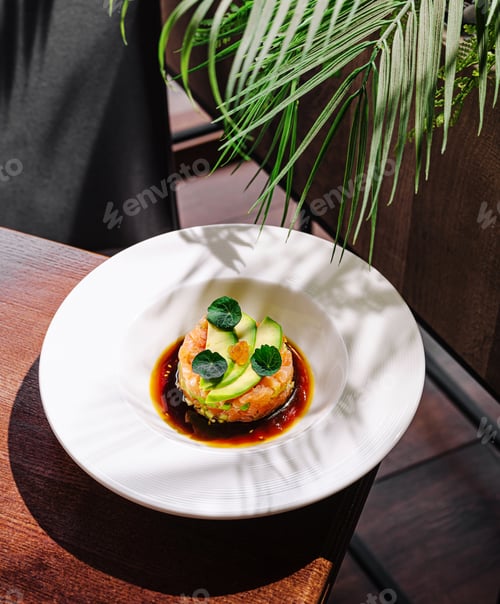 Preview: Unique gourmet dish served on a white plate with decor
