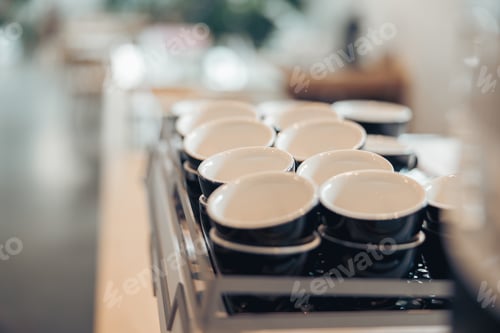 Preview: Black and white coffee cups in cafeteria or coffee shop