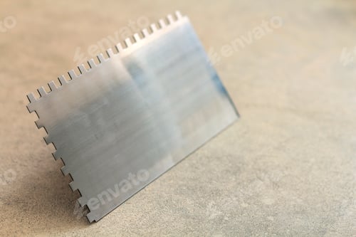 Preview: Construction notched trowel is a tool for tiles installation work