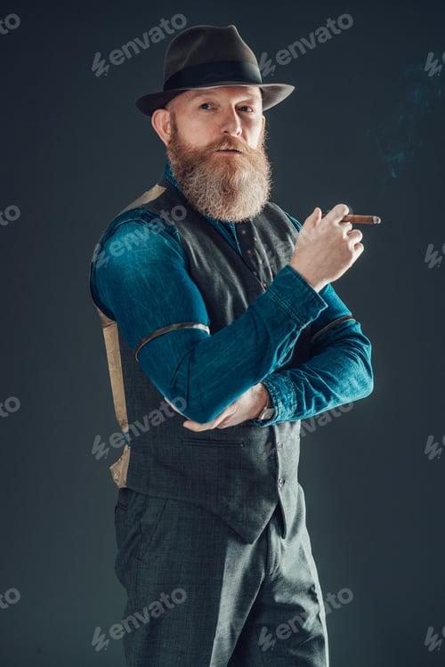 Preview: Portrait Of A Middle Age Man With Goatee Wearing Fashionable Wear Holding A Cigarette With One Arm