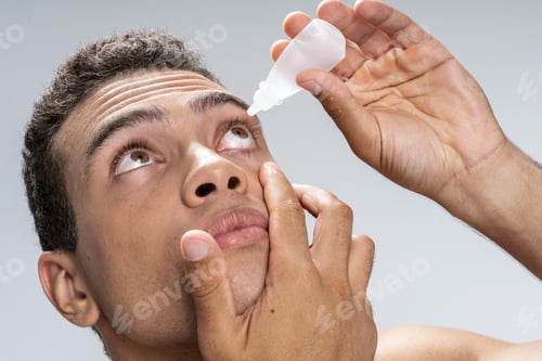 Preview: Young man taking care of his eyes