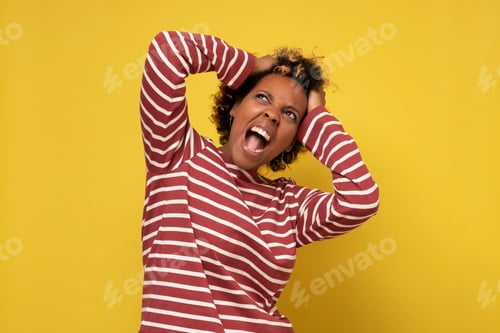 Preview: Young angry african woman being irritated and with stupid words.