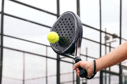 Preview: paddle tennis racket hitting ball. close- up on the racket