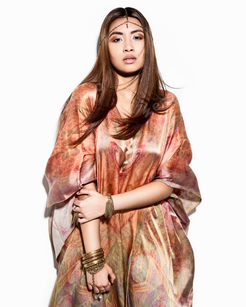 Preview: Portrait of young woman wearing kaftan dress