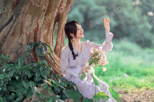 Woman in Floral Dress with Flowers in Nature