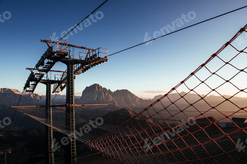 Preview: Ladder and net. Cableway standing on the hills in Seceda dolomites