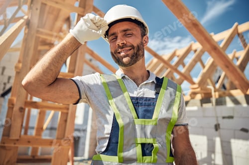 Preview: Handsome brunette male person touching his helmet
