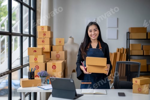 Preview: A woman is standing in front of a large stack of boxes