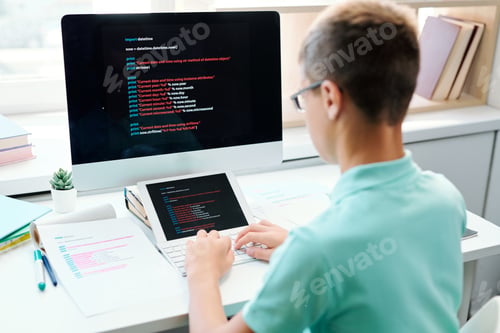 Preview: Mobile student of middle school typing on computer keypad
