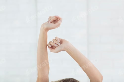 Preview: Young woman stretching, close-up of stretching arms