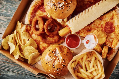 Preview: Unhealthy and junk food. Different types of fast food on the table, closeup