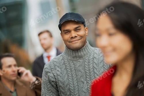 Preview: Group of people on the go,keeping in contact,using mobile phones,and talking to each other