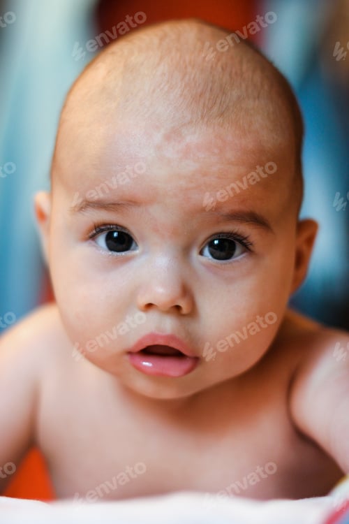 Preview: Nurse massages baby. Infant lying on tummy.