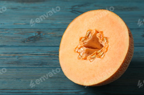 Preview: Ripe melon on wooden table, space for text