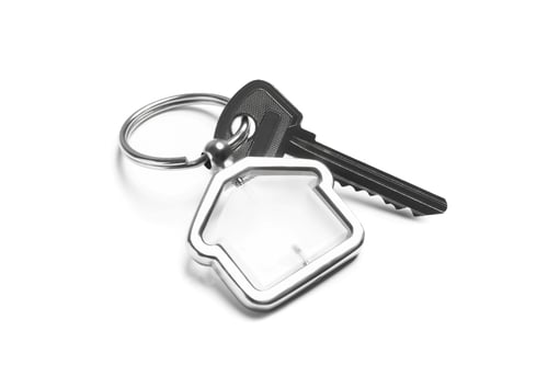 Preview: House key with trinket on white background