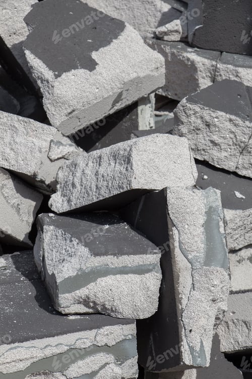 Preview: Vertical closeup shot of a pile of concretes