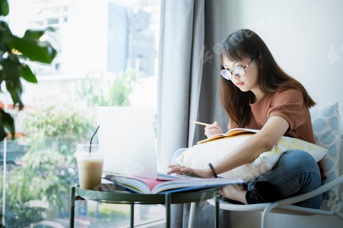 Preview: Teen girl using computer laptop to self learning online.