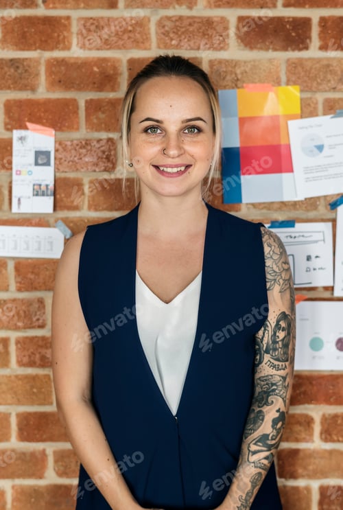 Preview: Portrait of Caucasian woman against brick wall