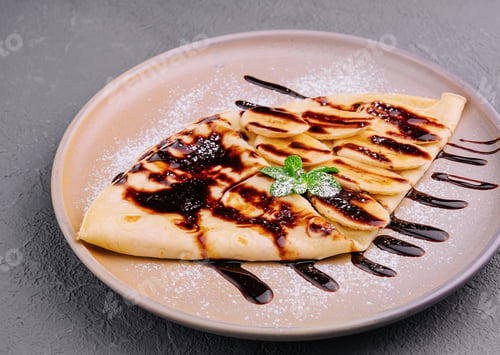 Preview: Crepes with fresh banana slaces and dark chocolate