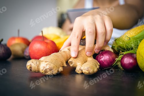 Preview: Close-up, ginger root on the kitchen table.