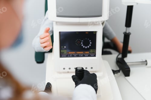 Preview: Close-up face of patient boy. Super modern equipment in a modern clinic for eye examination.