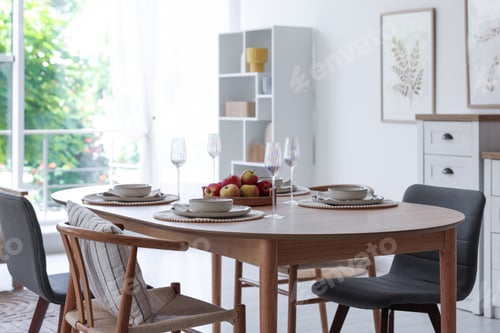 Preview: Beautiful table setting, chairs and decor in dining room. Interior design