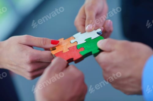 Preview: Group Of Business People Assembling Jigsaw Puzzle And Represent Team Support And Help Concept