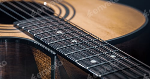 Preview: Close-up of a classical acoustic guitar in beautiful lighting.