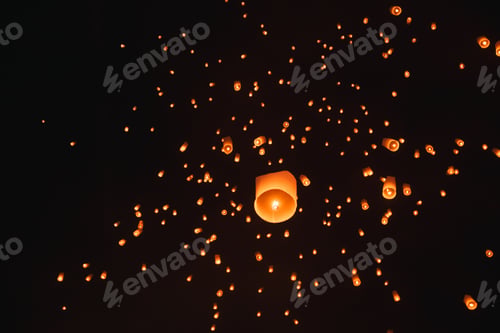 Preview: Loy krathong festival, thai new year party with floating lanterns release in the night sky