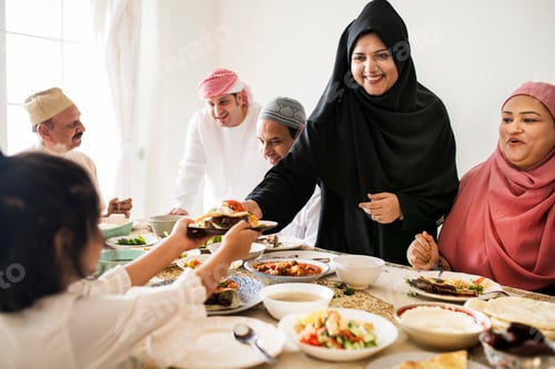 Preview: Muslim woman sharing food at Ramadan feast