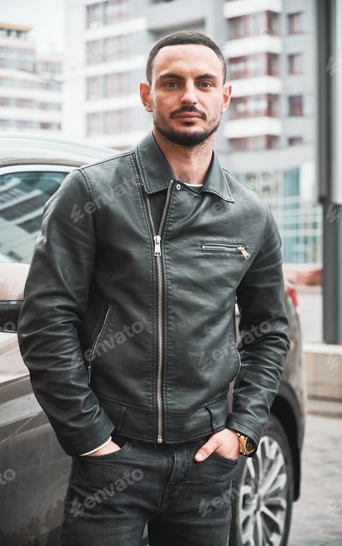 Preview: Young man posing near his modern car
