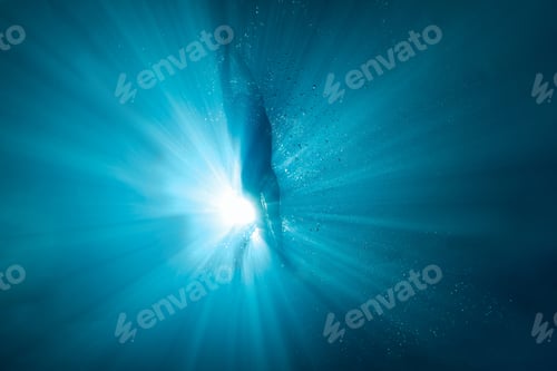 Preview: underwater picture of professional swimmer exercising in swimming pool