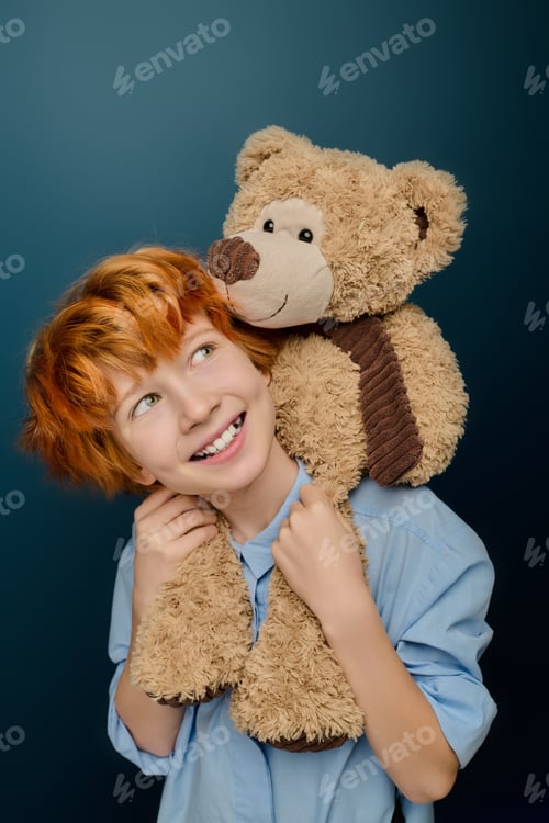 Preview: Joyful laughter fills the room as a little boy bonds with his cuddly teddy bear companion