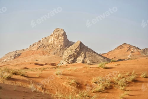 Preview: Beautiful red rippled desert sandscape landscape with triangular shaped geological rock formations