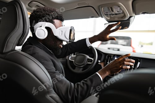 Preview: Businessman using 3D virtual glasses to explore car interior