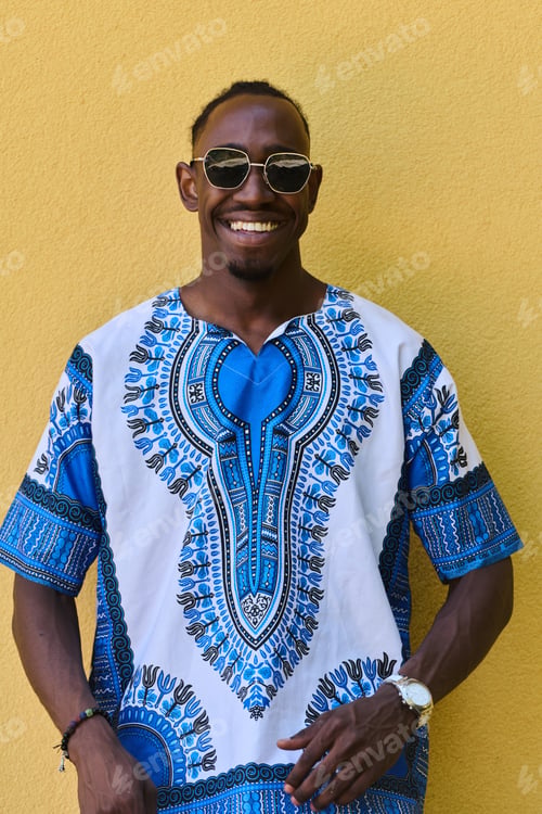 Preview: Sudanese Tradition Meets Modern Youth: African American Teen in Vibrant Traditional Attire Against a