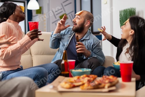 Preview: DIverse team of coworkers playing charades after work