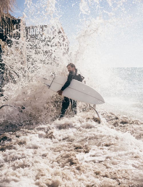 Preview: Male surfer running in sea, Santa Barbara, California, USA