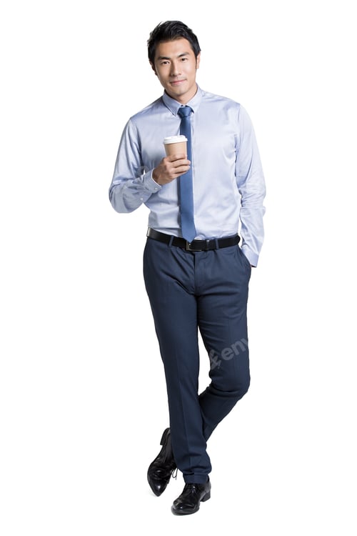 Preview: Confident businessman holding a cup of coffee