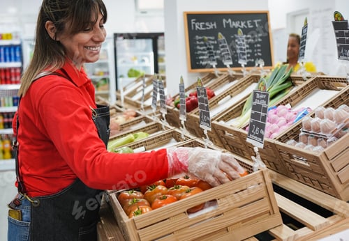 Preview: Mature latin woman working inside mini market