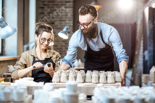 Preview: Man and woman working in the pottery shop