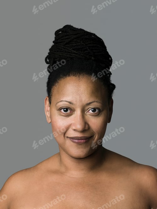 Preview: Confident woman with elegant updo hairstyle posing for a portrait